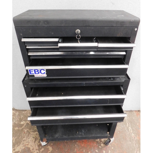 542 - Black metal toolbox on wheels, with lockable top - key in office