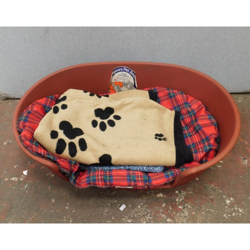 559 - Moulded dog bed and blankets