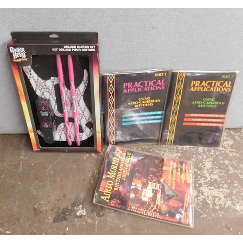 637 - Guitar Hero customisation kit and 3x song book and cassette packs