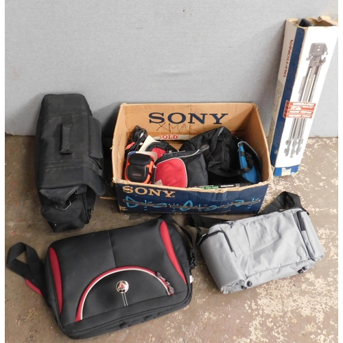 703 - Box of camera bags, tripod etc,