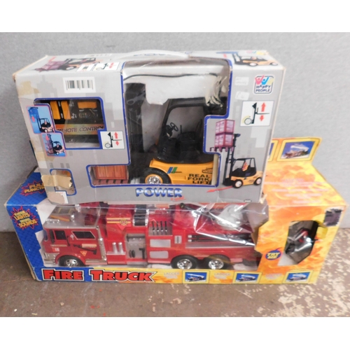 704 - Boxed R/C fire truck and R/C fork lift - unchecked