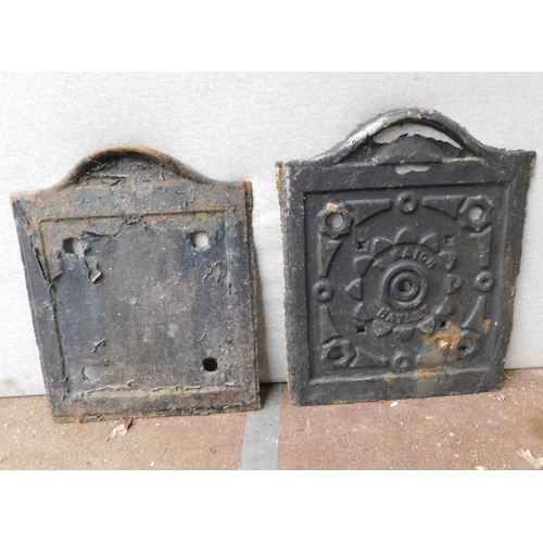 567 - Two cast coal grate covers