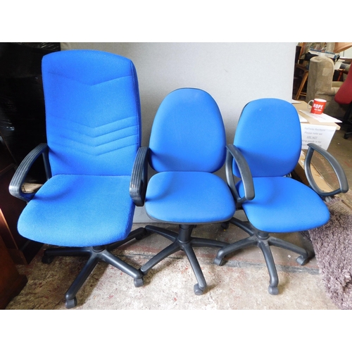 594 - Three swivel office chairs