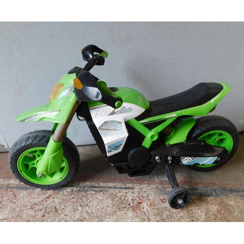 596 - Small battery operated children's bike with battery and charger