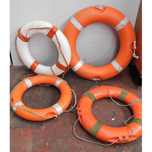 557 - Four life rings / lifebuoys