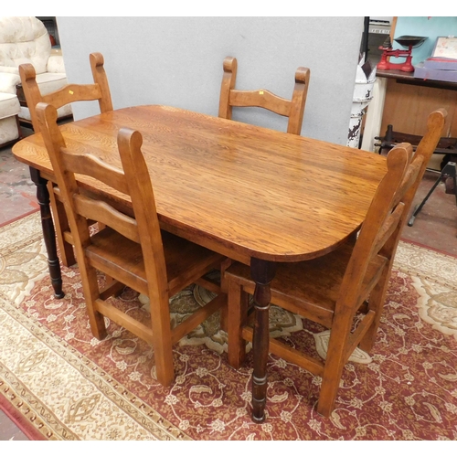 576 - Oak table and four solid chairs