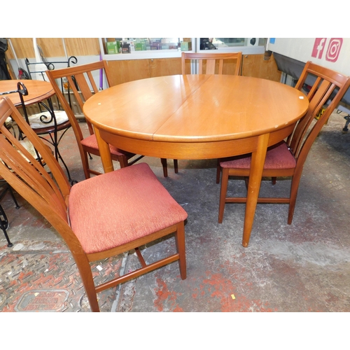 598 - Mid century circular extending table and four chairs