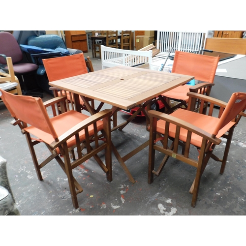 610 - Wooden patio set with four chairs - one as seen