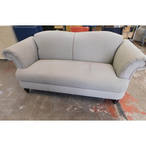 554 - Sofology grey 2/3 seater sofa (arms need securing)