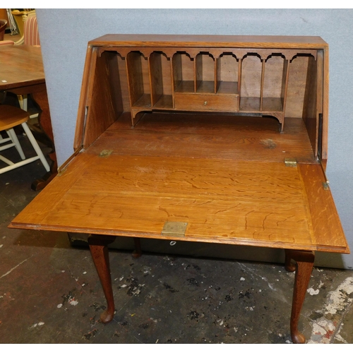 571 - Vintage oak writing bureau with brass detail