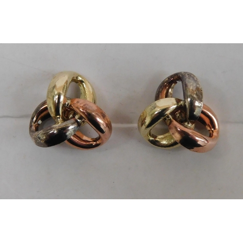 138 - Pair of knot earrings in tri-gold (9ct) - weight 0.73g