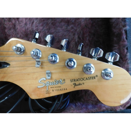 1 - Squire Stratocaster electric guitar W/O - but needs a replacement string, with hard case