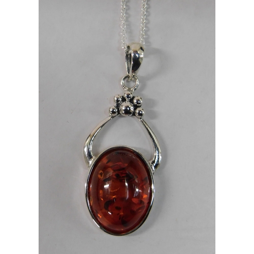 220 - Silver and amber pendant on silver chain