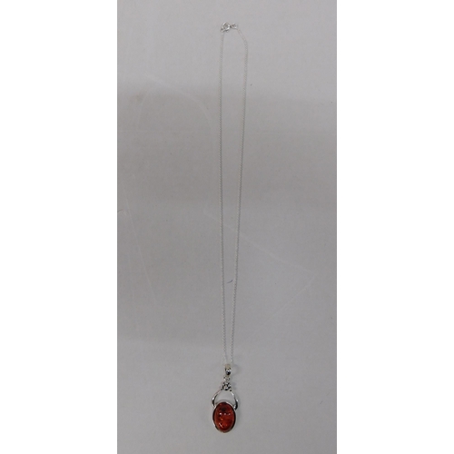 220 - Silver and amber pendant on silver chain