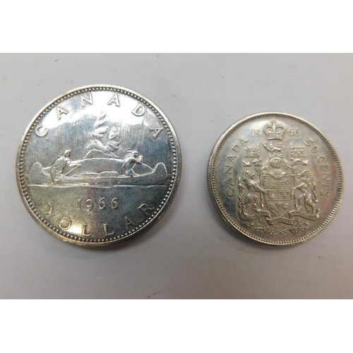 242 - 1966 Voyager Canadian dollar and 50 cent coin