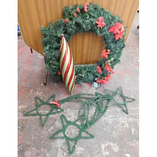 294 - Large Christmas wreath, outside large bauble and three shooting stars