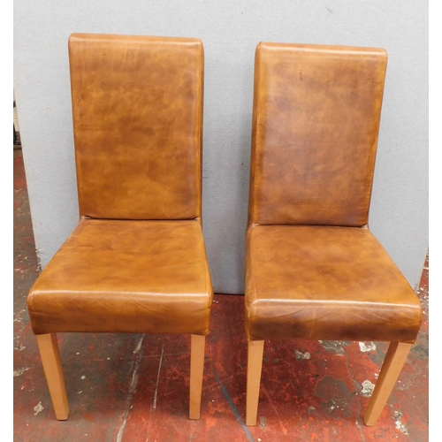 457 - Two leather style chairs