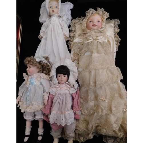 82 - Four porcelain dolls - no boxes