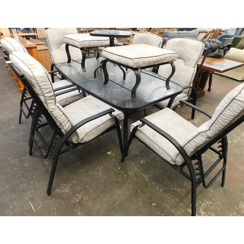 385 - Glass topped patio table with chairs, 2 footstools, side table and cushions