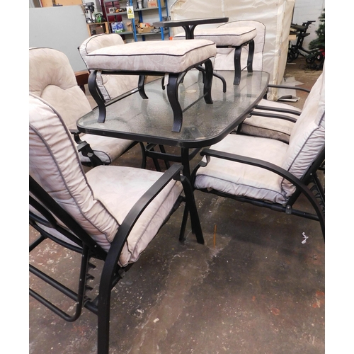 385 - Glass topped patio table with chairs, 2 footstools, side table and cushions