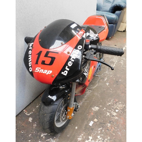 412 - Unused Honda Mini - Motorbike in working order. 49cc in red and black