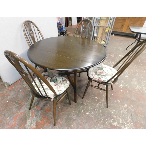 142 - Dropleaf oval Ercol dining table (approx. 45