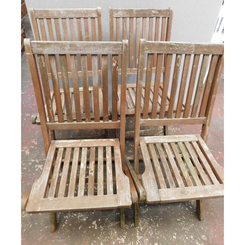 143 - Four wooden garden chairs