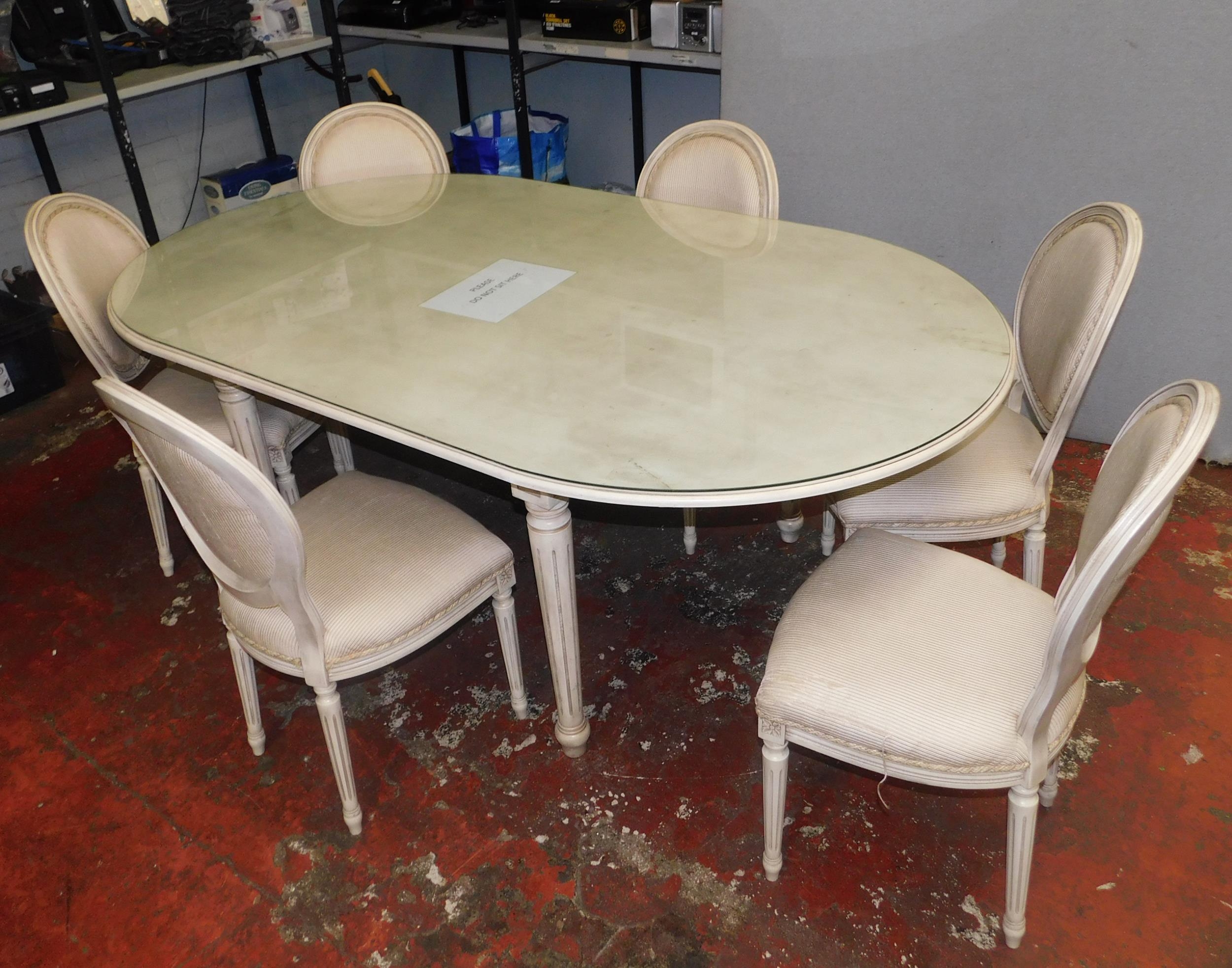 Large glass topped dining table and six chairs