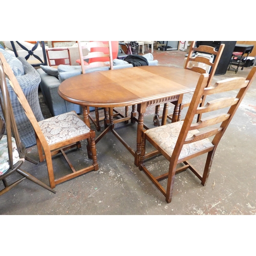 77 - Oak dropleaf table and four chairs