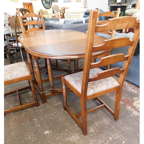 77 - Oak dropleaf table and four chairs