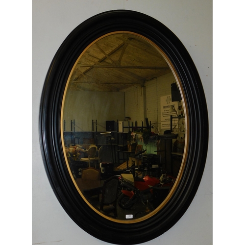 85 - Large oval framed bevel edged mirror - approx. 48