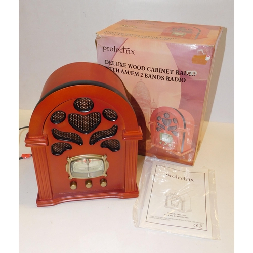 104 - Boxed/unused Deluxe wood cabinet radio