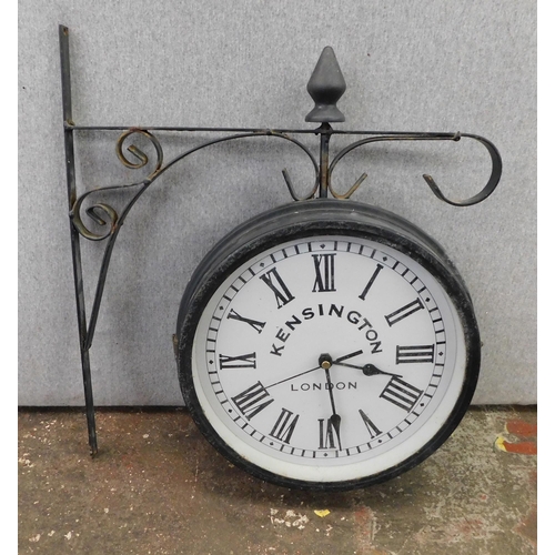 114 - Double sided clock on bracket W/O