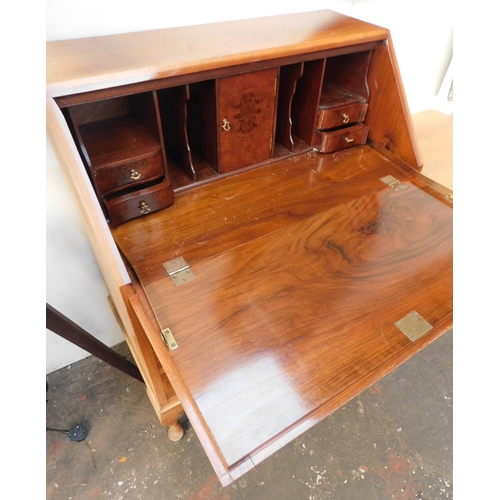 256 - Walnut veneered three drawer writing bureau