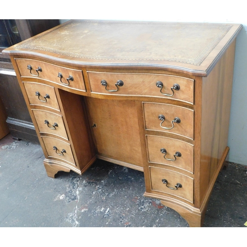 267 - Leather topped knee hole desk