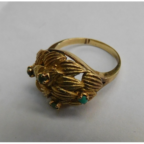 407 - 18ct ring with green stones - weight 5.7g