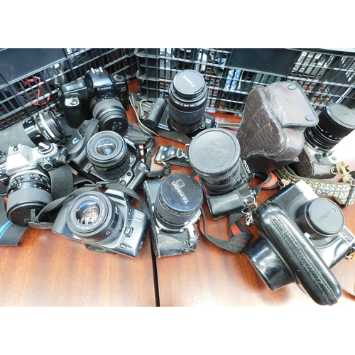 67 - 2 boxes of mainly SLR cameras including Canon, Minolta, Pentax etc.