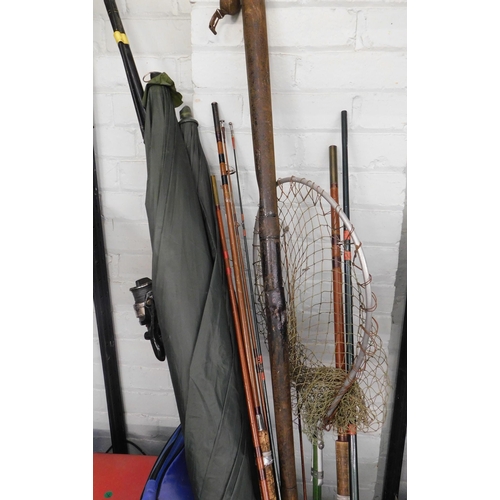 85 - Large collection of fishing rods, umbrellas, tackle box etc.