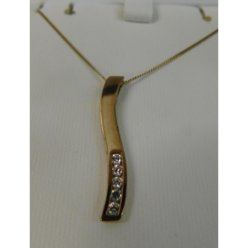 511 - 9ct Gold chain with 9ct waved pendant and pair of 9ct matching diamond earrings - necklace weight 2.... 