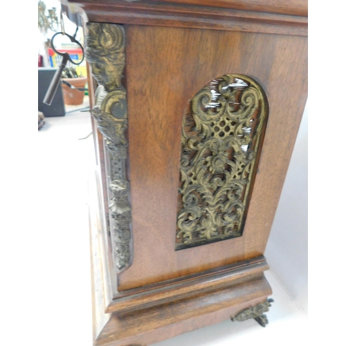 481 - Antique walnut chiming table clock with pierced brass fretwork with key - need attention