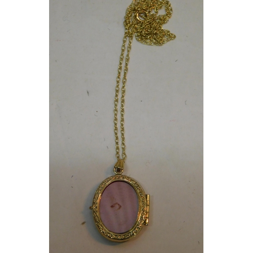 482 - 9ct Gold chain and 9ct gold triple locket - weight 2.8g