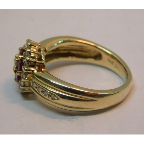 489A - 14K Gold ring set with ruby's (6) and diamonds (23) RRP £1000 - combined weight 6.66g