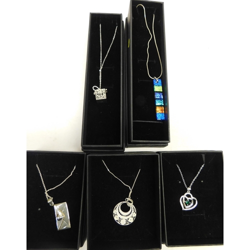 497A - Five silver chains with various pendants; glass, envelope, Italian