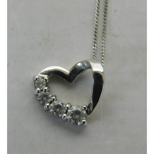 502 - 9ct White gold chain and floating heart pendant set with stones - weight 2.2g