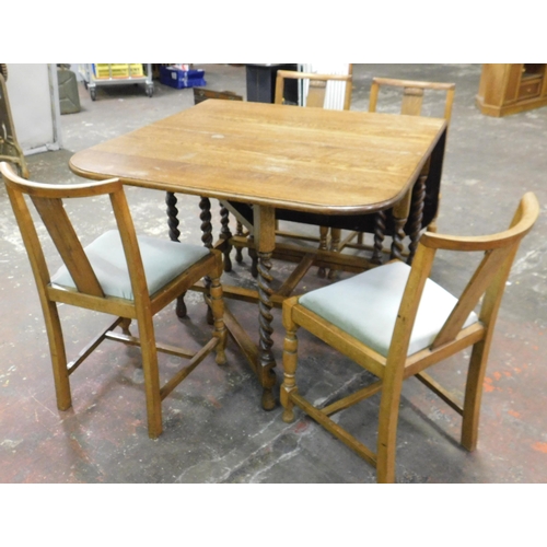 257 - Oak drop leaf table and four chairs