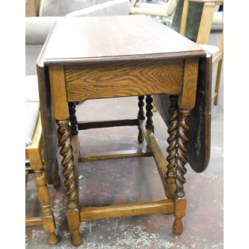 257 - Oak drop leaf table and four chairs