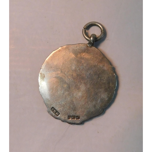 425 - Silver fob with gold relief