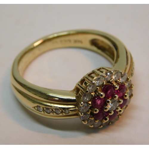 415 - 14K Gold ring set with ruby's and 23 diamonds - RRP £1000, combined weight 6.66g