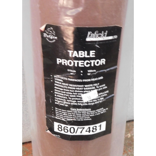 23 - Unused roll of table protector