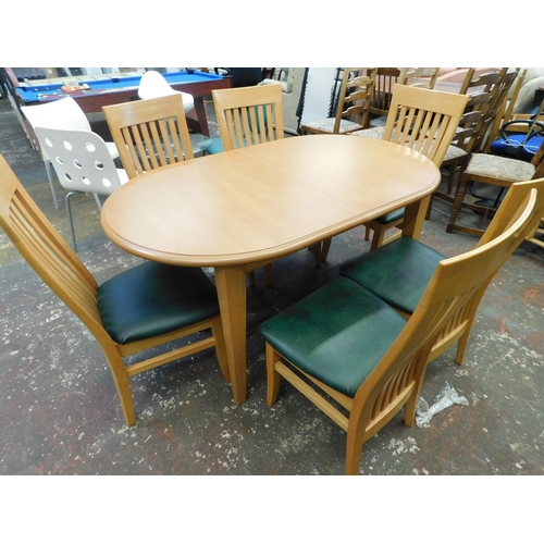 247 - Beech coloured extending dining table and six chairs